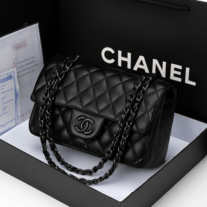 Chanel diamond chain shoulder bag in black, showcasing its iconic quilted design and signature chain detail.