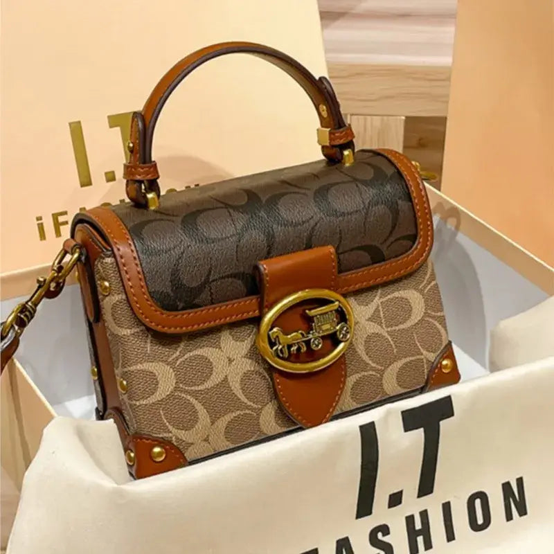 Coach Color Crossbody Handbag in stylish box with elegant design and signature craftsmanship.
