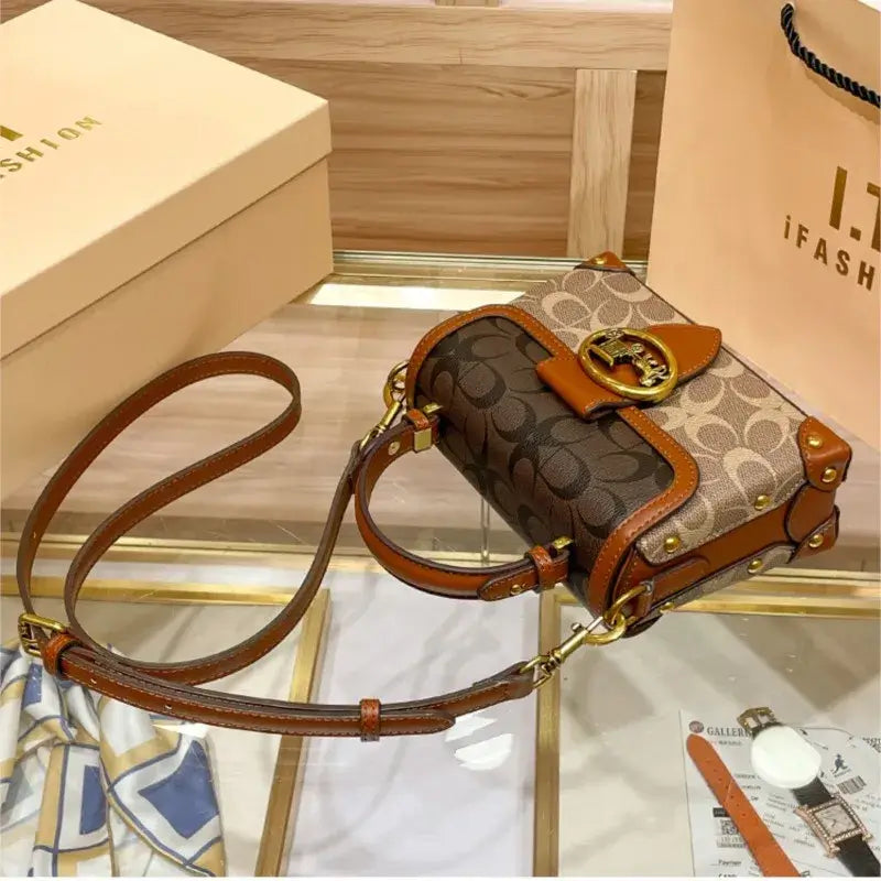 Coach Color Crossbody Handbag displayed on a table with stylish design and quality details.